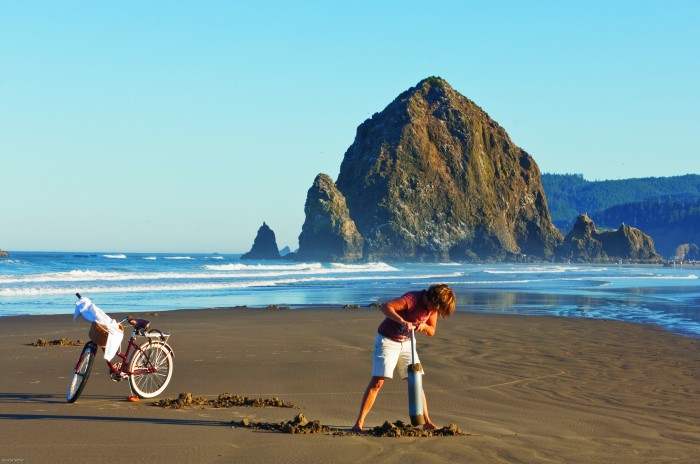 2012-Spring-Oregon-Coast-Travel-Cannon-Beach-Haystack-Rock-woman-clam-digging-sand-ocean
