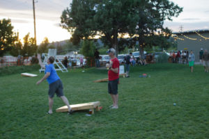 Customers at Crux Fermentation Project in Bend play cornhole and other recreational games. Photo by Rob Kerr