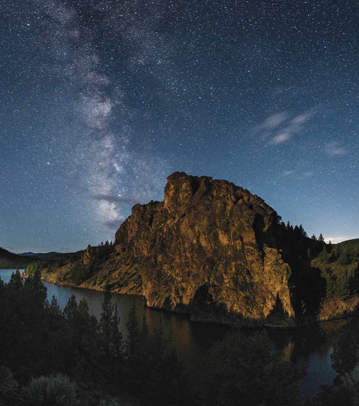 The pre-dawn Milky Way slides past “Dino Rock” along the entry road to Prineville Reservoir State Park.