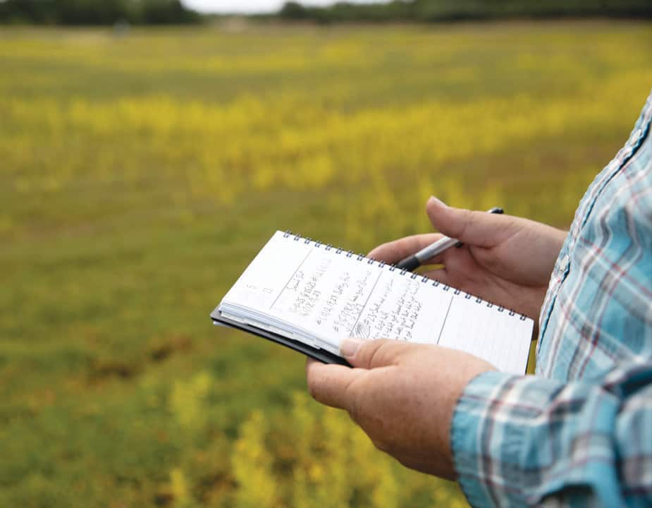 Whit Peters keeps a journal to refine the best times to fertilize his cranberry crops.