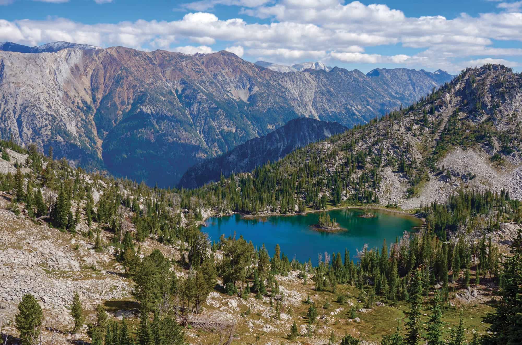After a long, steady climb, hikers are rewarded with stunning views of the Wallowas and Chimney Lake.