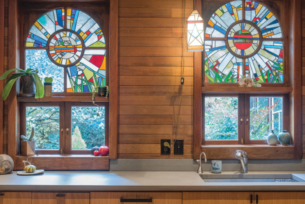 The design team aimed to improve functionality and update the room’s aesthetic while preserving existing details, such as these stained-glass windows.