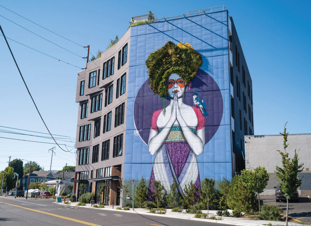 Artwork by Irish street artist Fin DAC graces the side of a buiding in Portland.