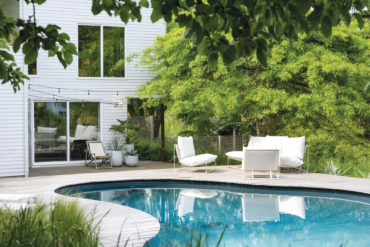 Connie Migliazzo and husband renovated the pool area with textural ferns while keeping it simple for many uses.