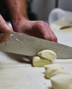 Preparation for chef Franco Console’s Ale-Braised Rabbit with Ricotta Gnocchi at Larks Home Kitchen in Ashland.
