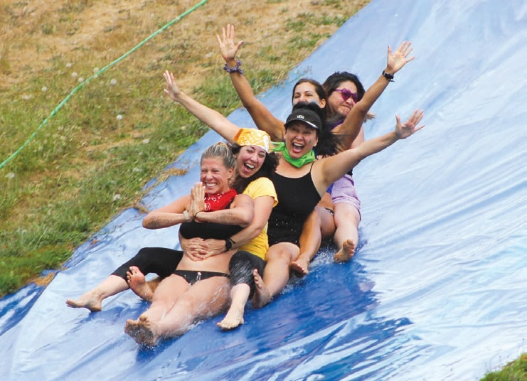 The fun factor at Camp YES includes slip-and-slides and team egg tosses.
