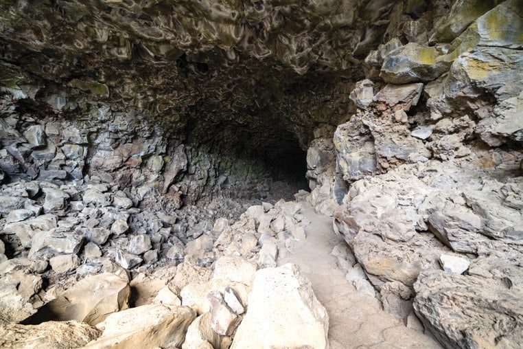 A cave entrance to volcanic flows at Lava Beds National Monument.